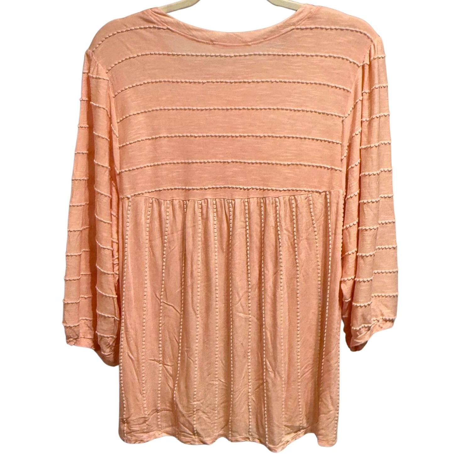 Back view of Chris & Carol light peach pink babydoll top with stitched stripe texture and relaxed fit.