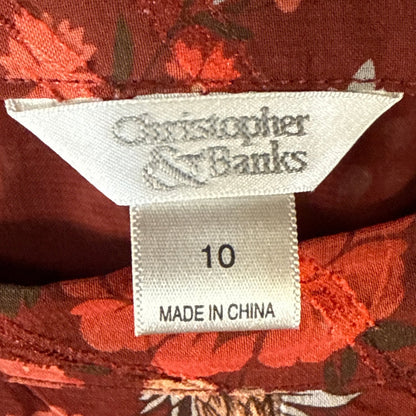 Close-up of Christopher & Banks clothing label showing size 10 inside dark red floral print skirt.
SEO