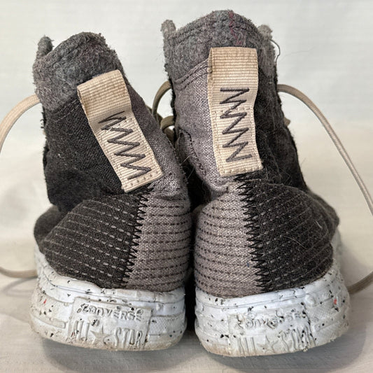 Back view of Converse Crater high-top sneakers showing gray and black textured fabric, heel pull tabs, and speckled soles.