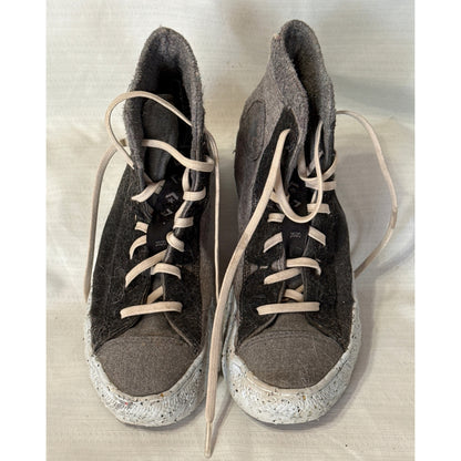 Front view of Converse Chuck Taylor All Star Crater high-top sneakers showing gray toe panels, black textured uppers, and ecru laces.