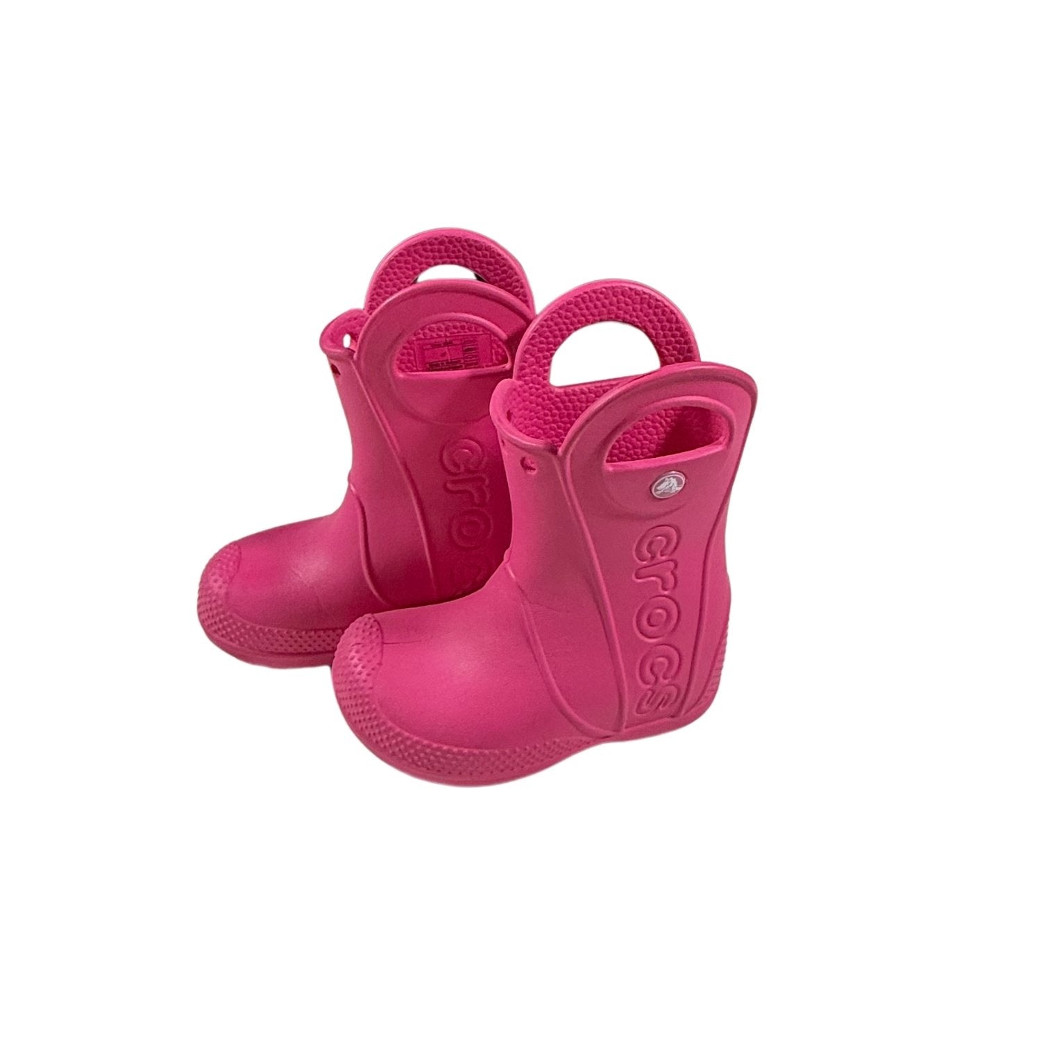 Side view of pink Crocs waterproof rain boots for toddlers.