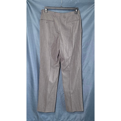 Back view of David Taylor men's gray dress pants showing belt loops and two buttoned welt pockets.