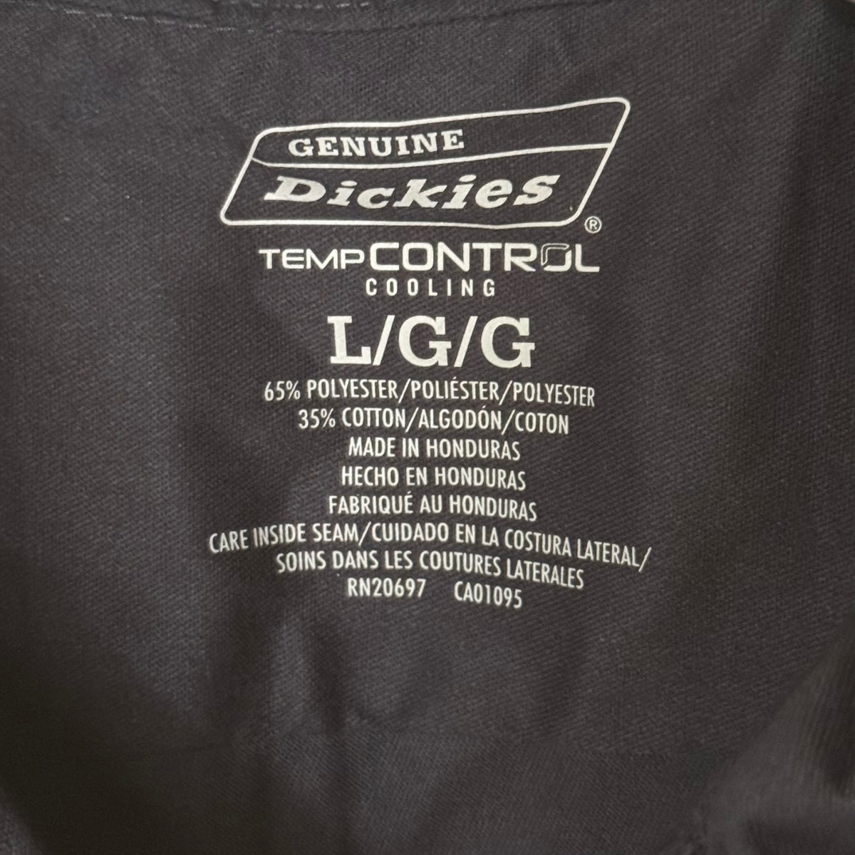 Genuine Dickies Temp Control Cooling men's large shirt label showing 65% polyester and 35% cotton fabric content.