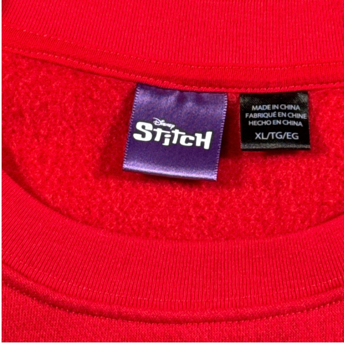 Disney Stitch adult XL brand and size labels inside red Christmas sweatshirt