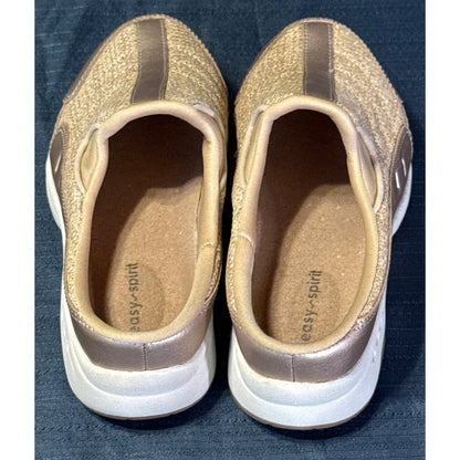 Interior view of Easy Spirit mule sneakers showing tan insoles, branding, and padded openings.

