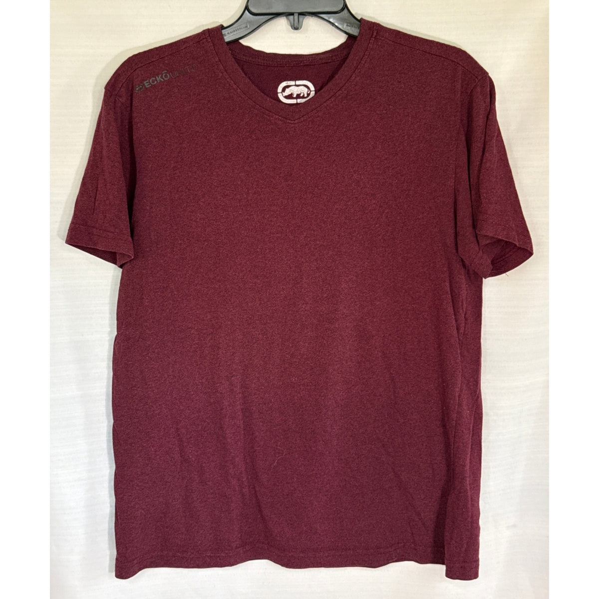 Front view of burgundy Ecko Unltd. men’s medium V-neck T-shirt with subtle heathering and a straight hem.