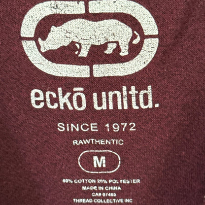 Ecko Unltd. neckline label showing size medium and 80% cotton, 20% polyester fabric content.