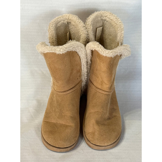 Front view of FabKids tan faux suede boots showing rounded toes, cream faux fur trim, and curved split-side openings.