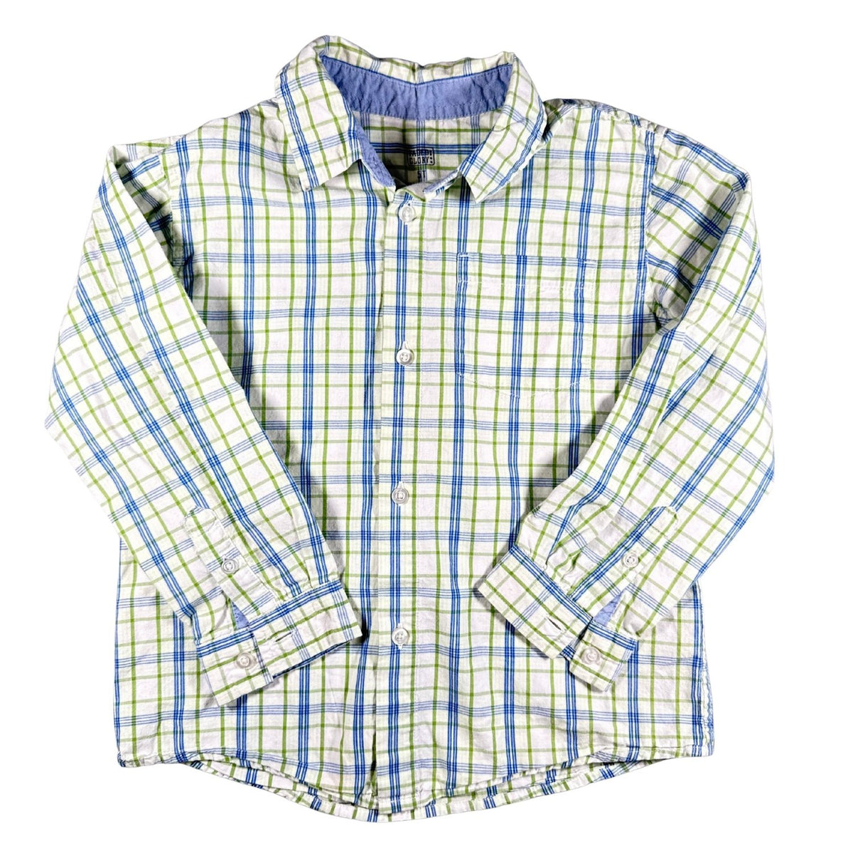 A long-sleeve button-up shirt for a child, featuring a green and blue plaid pattern on a white base, laid flat against a white background.