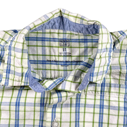 Close-up of Faded Glory boys size 5T and 100% cotton printed shirt label.