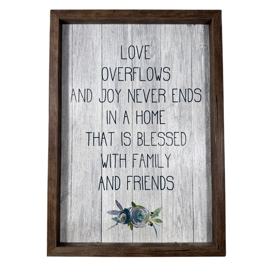Framed farmhouse wall art with family quote and blue floral accents