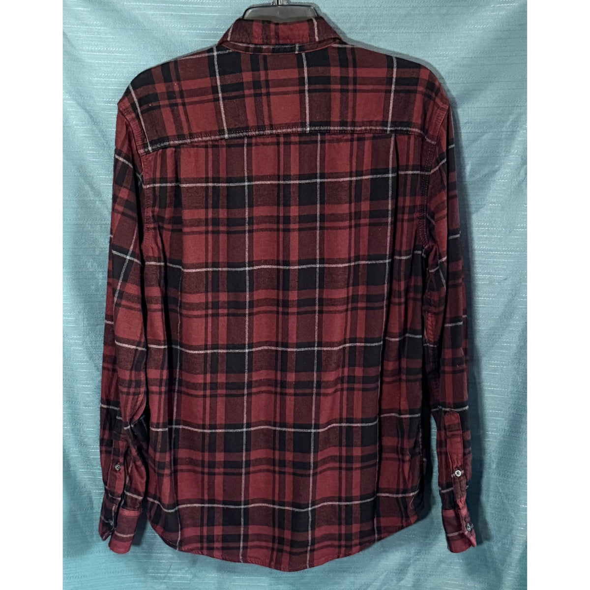 Back view of George men's medium burgundy and black plaid long sleeve flannel shirt with curved hem and back yoke.