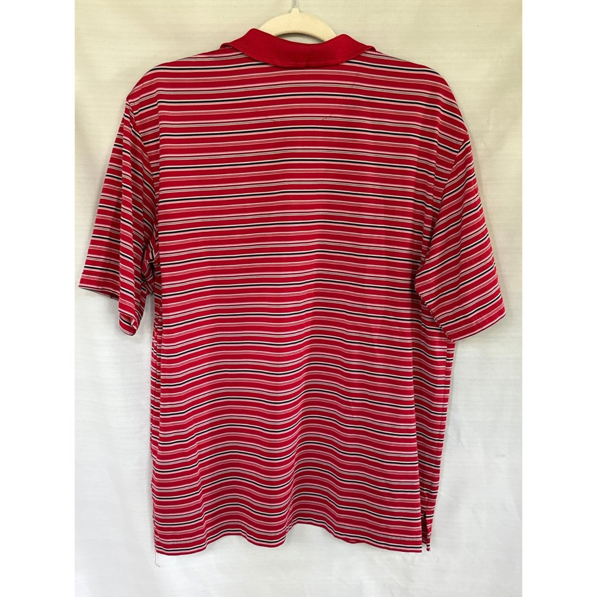 Back view of a George men’s large red polo shirt with black, white, and pink horizontal stripes.