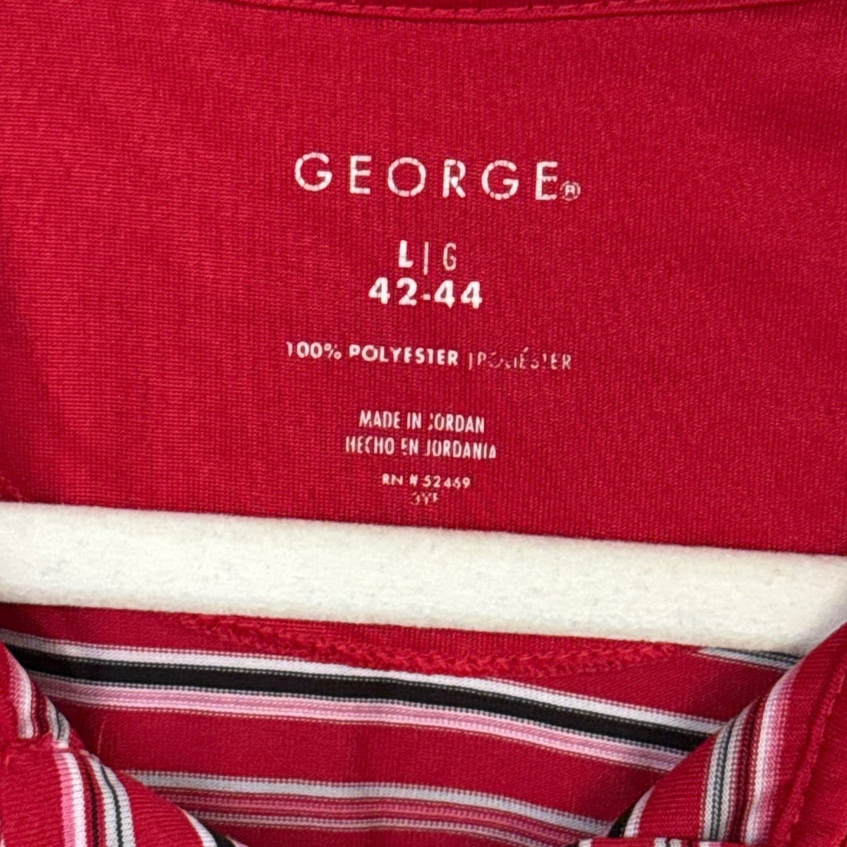 George printed neckline label showing size large 42–44, 100% polyester, and made in Jordan.