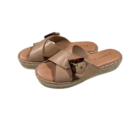 Side angle showing espadrille jute trim and tortoise buckle.
