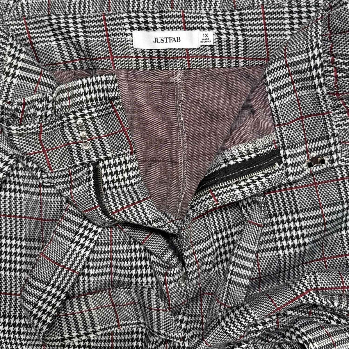 Close-up of JustFab women’s 1X plaid pants tag, tie belt, hook closure, and zipper