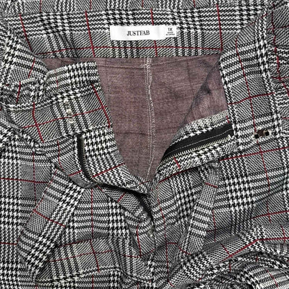 Close-up of JustFab women’s 1X plaid pants tag, tie belt, hook closure, and zipper