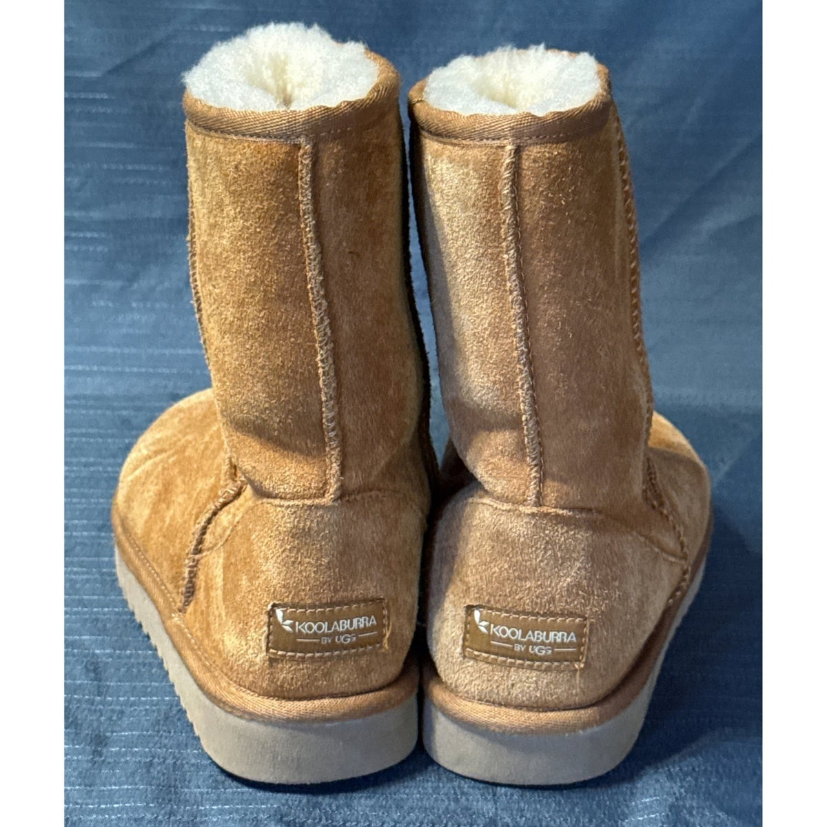 Back view of Koolaburra by UGG chestnut boots showing stitched seams and branded heel patches.