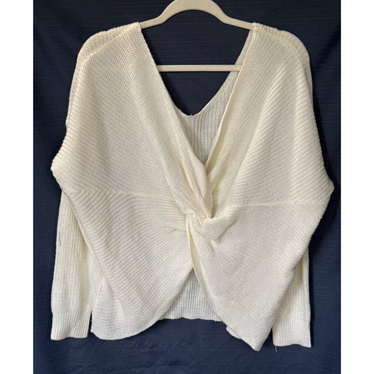 Front view of an ivory Lara Fashion sweater with a draped twist front, V-neckline, and long sleeves.