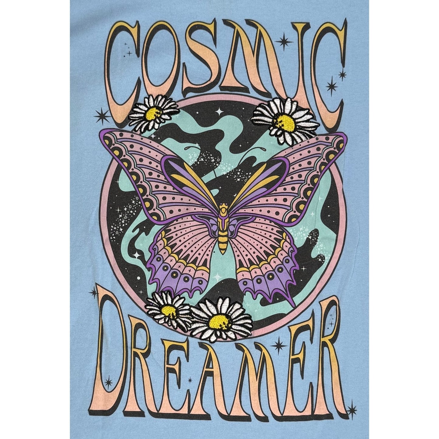 Embroidered butterfly and floral detail on Cosmic Dreamer shirt