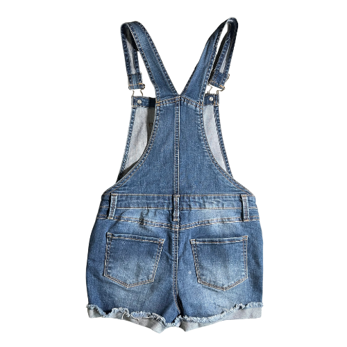 Back of Gently used blue jean overalls for big girls size 8, by So, featuring snap sides, 5 pockets, rolled-up legs, and belt loops. Made from 68% cotton, 24% recycled polyester, 7% rayon, and 1% spandex. Our Families Attic