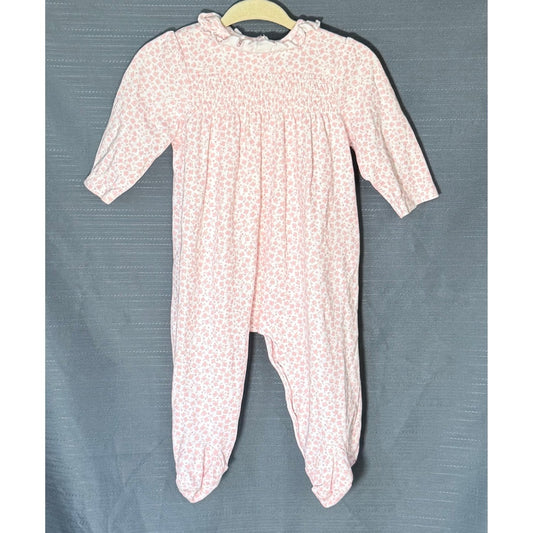 Front view of Little Me baby girls pink floral footed sleeper, size 6 months, featuring smocked chest and ruffled neckline.