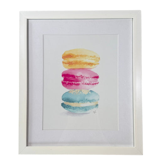 Framed macaron wall art with pastel yellow pink and turquoise colors on cream background