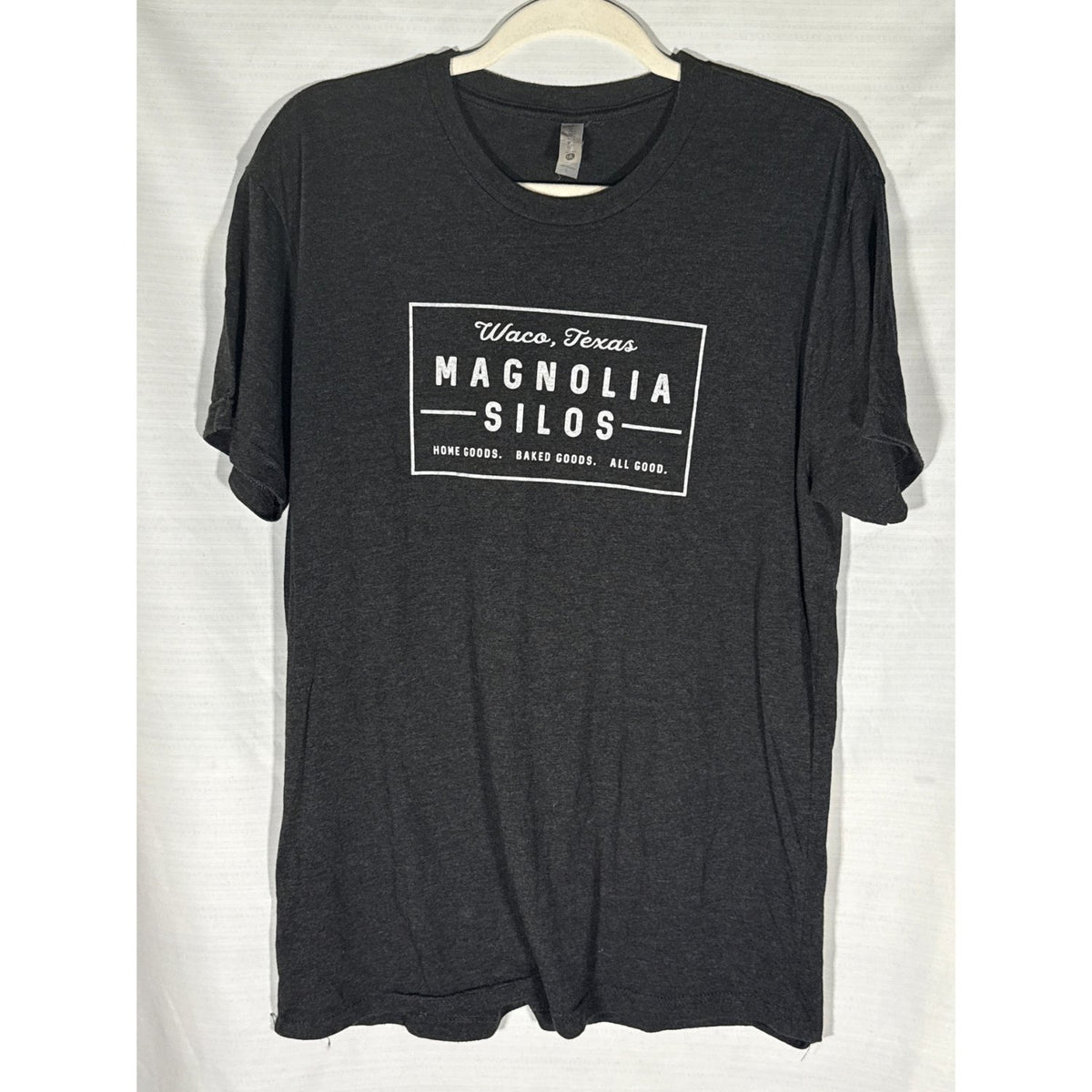 Front of heather black Magnolia Silos Waco graphic T-shirt with white print.