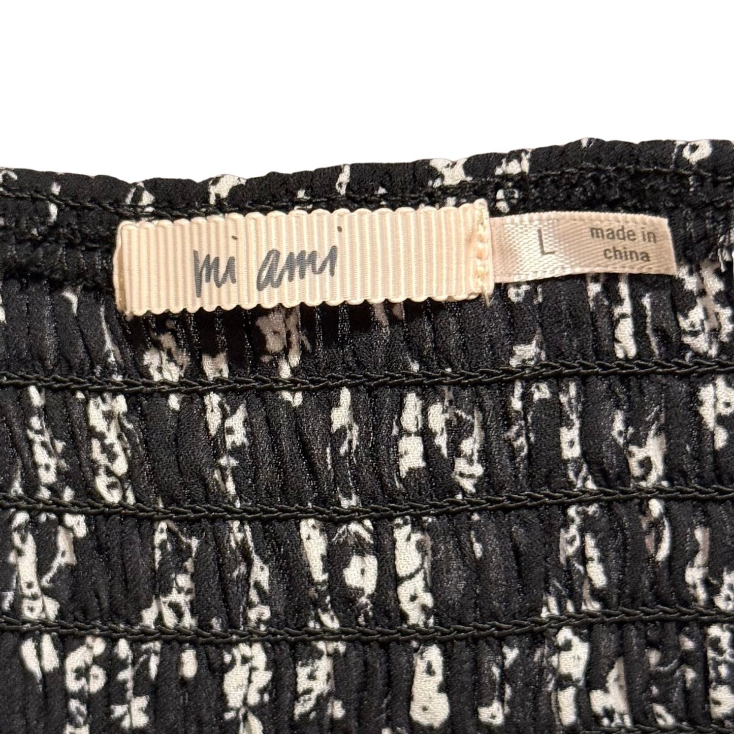 Mi Ami women's size large clothing label.