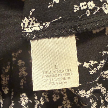 Material tag showing 100% polyester shell and lining.