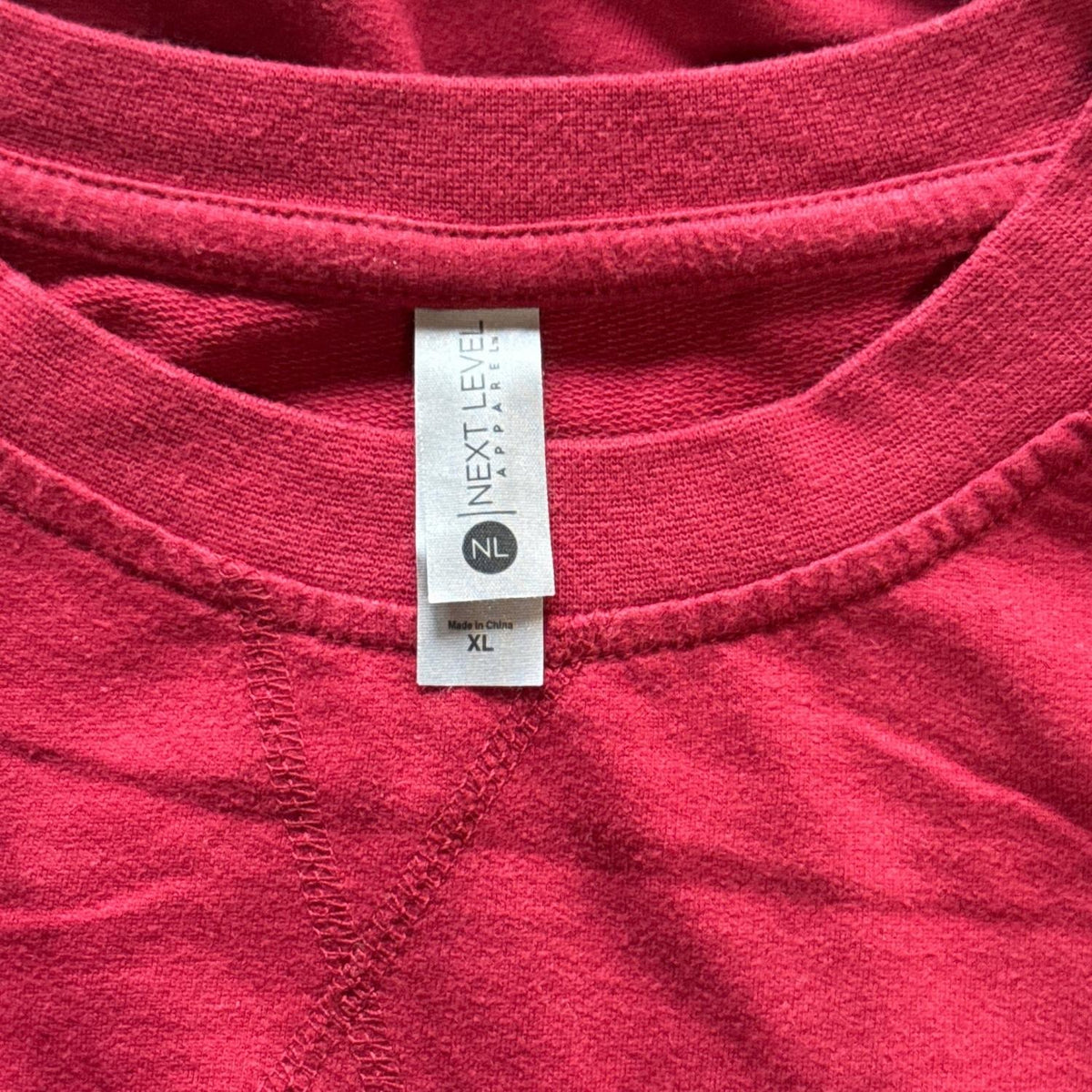 Next Level Apparel XL label inside dark red Make It Make Sense sweatshirt