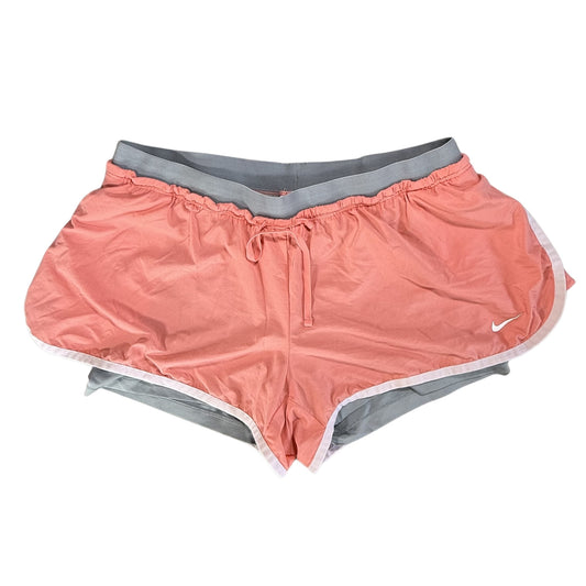 Orange Nike Dri-FIT athletic shorts with gray and white trim