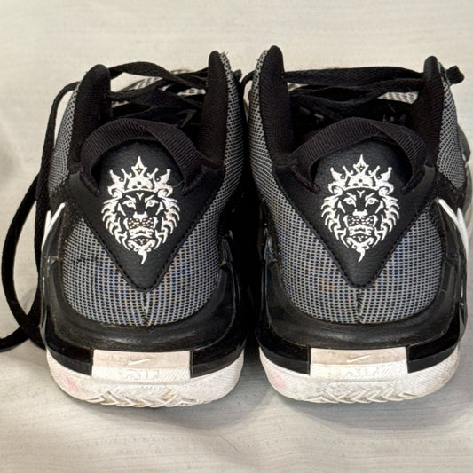 Back of Nike LeBron Witness 7 sneakers featuring white lion graphics and black and gray mesh.