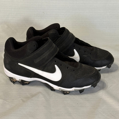 Right-facing angled view of Nike baseball cleats showing white Swooshes, perforated uppers, and molded studs.