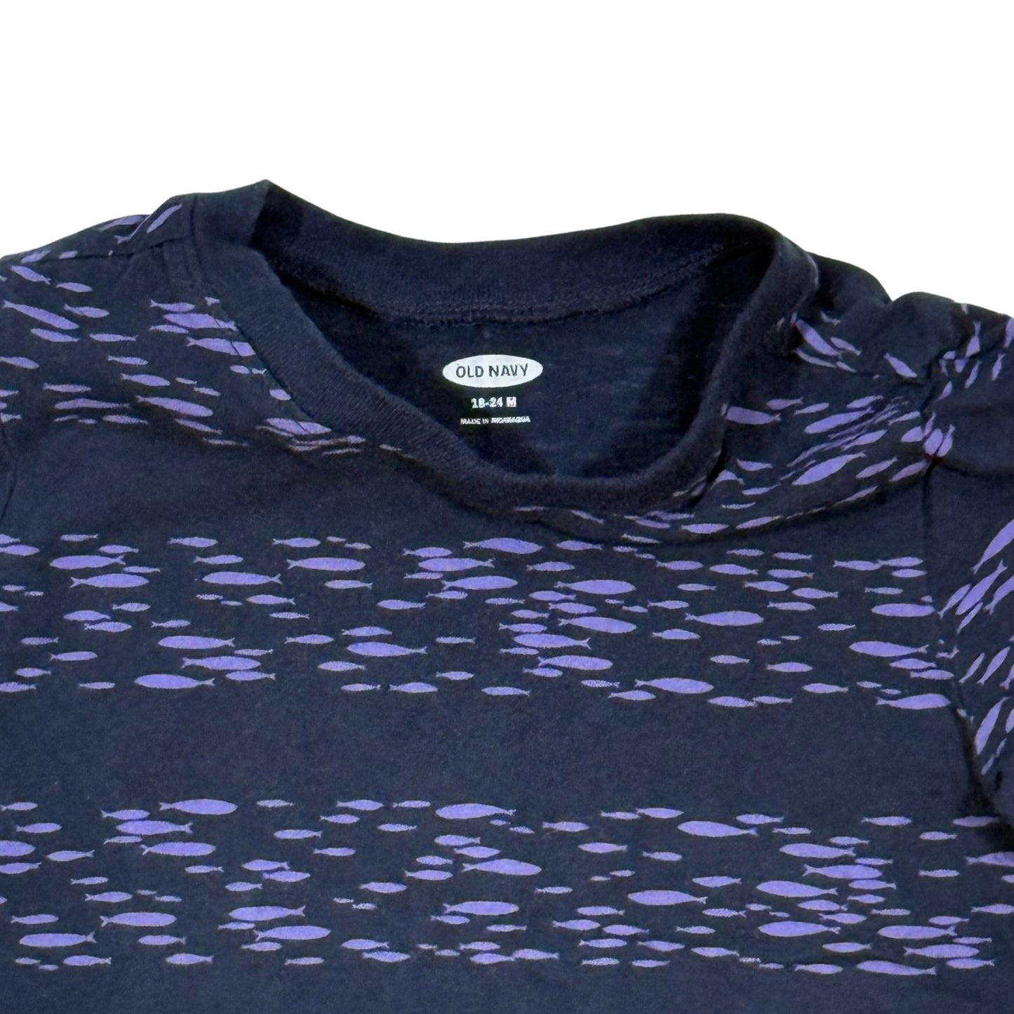 Close-up of Old Navy 18-24 month size label and purple fish print