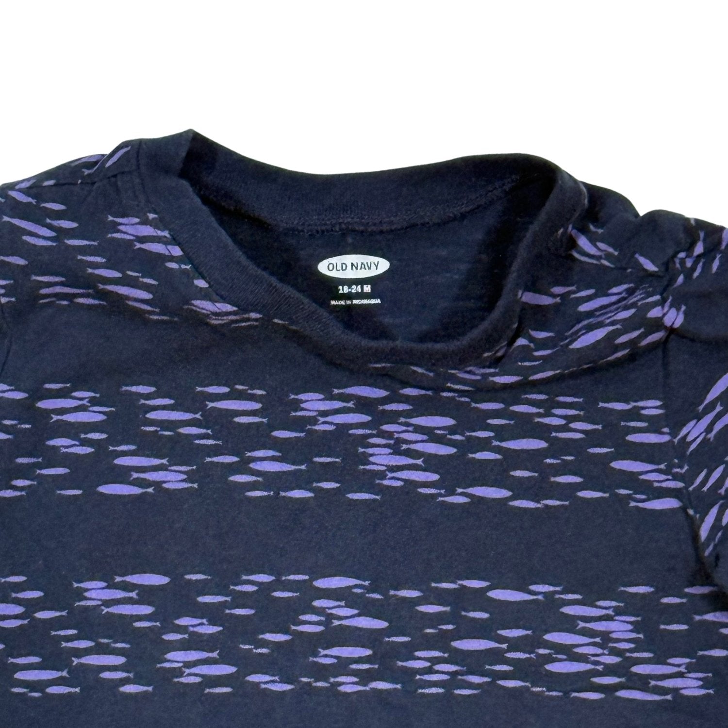 Close-up of Old Navy 18-24 month size label and purple fish print