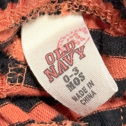 Old Navy baby pants clothing label showing size 0–3 months and made in China.