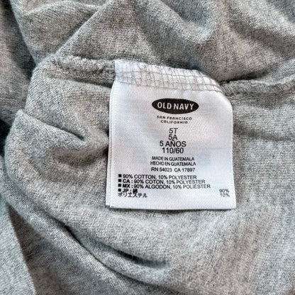 Old Navy boys size 5T shirt material and care tag showing 90 percent cotton and 10 percent polyester