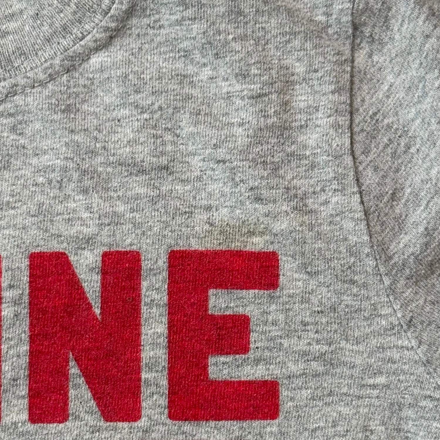 Close-up of small spot on front of Old Navy boys size 5T train shirt