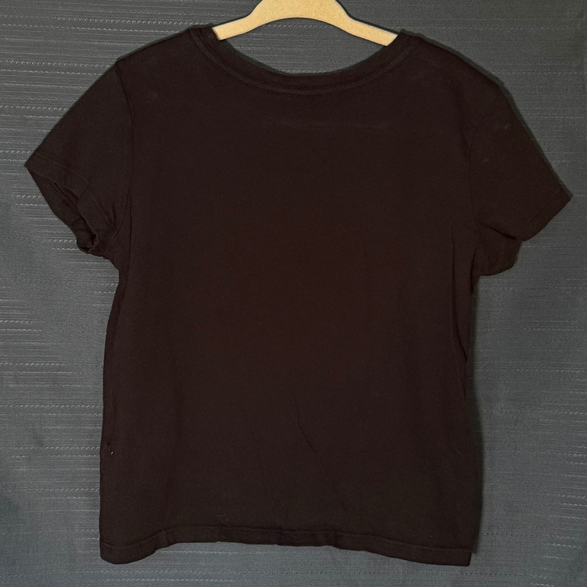 Back of Old Navy girls solid black short-sleeve crew neck Halloween T-shirt, size 6–7.