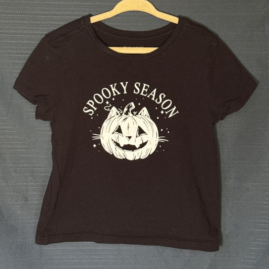 Old Navy girls black Halloween graphic T-shirt featuring white Spooky Season lettering and cat-faced jack-o'-lantern illustration, size 6–7.