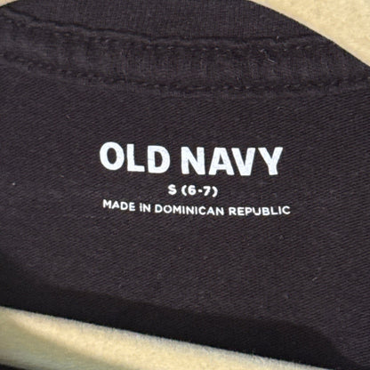 Old Navy girls clothing label showing size Small 6–7 inside black Halloween T-shirt.