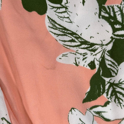 Small snag and marks on peach floral dress fabric