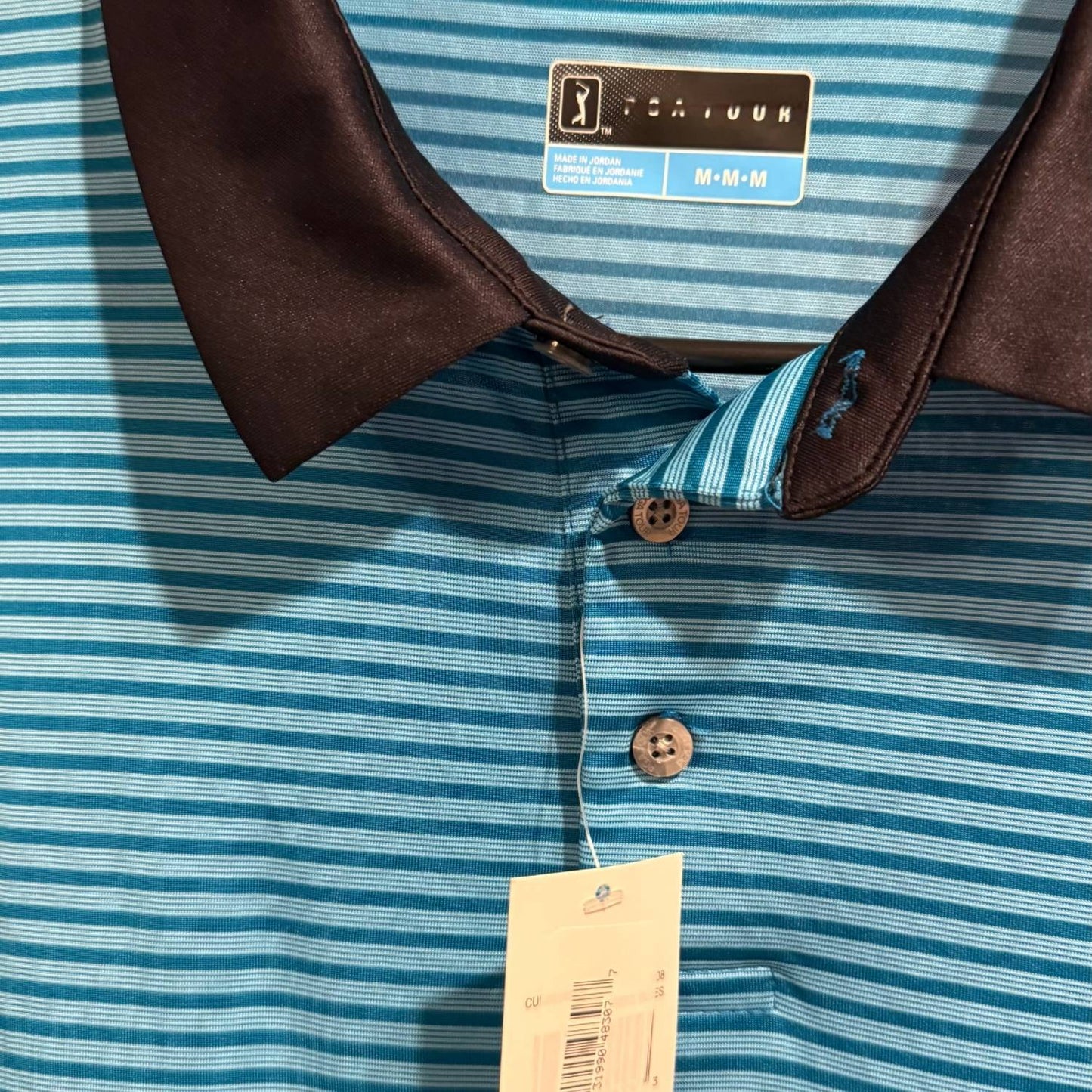 PGA TOUR brand label on men's Medium blue striped performance polo.