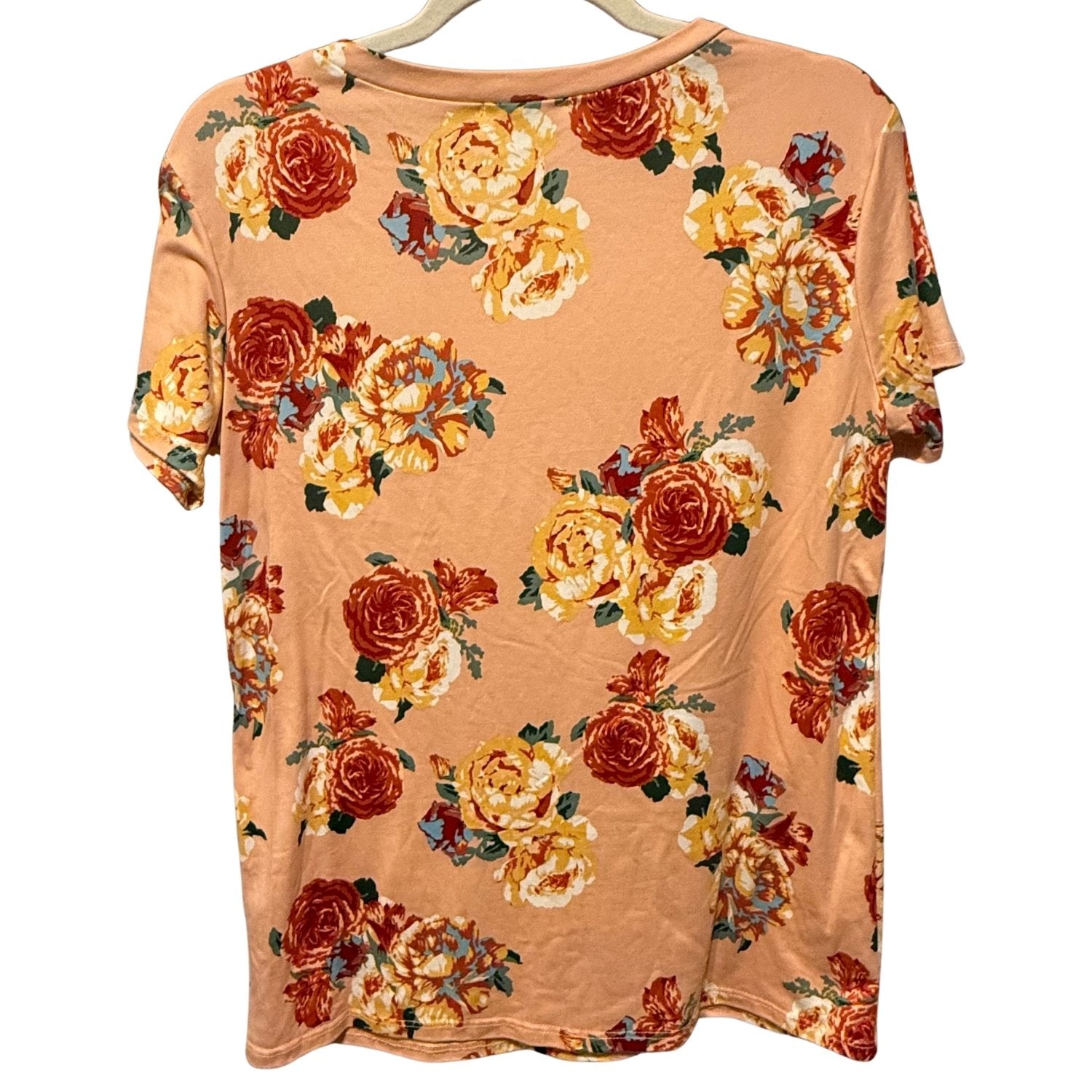 Back view of Reb & J women's peach floral short sleeve top featuring an allover floral print on a peach background.
