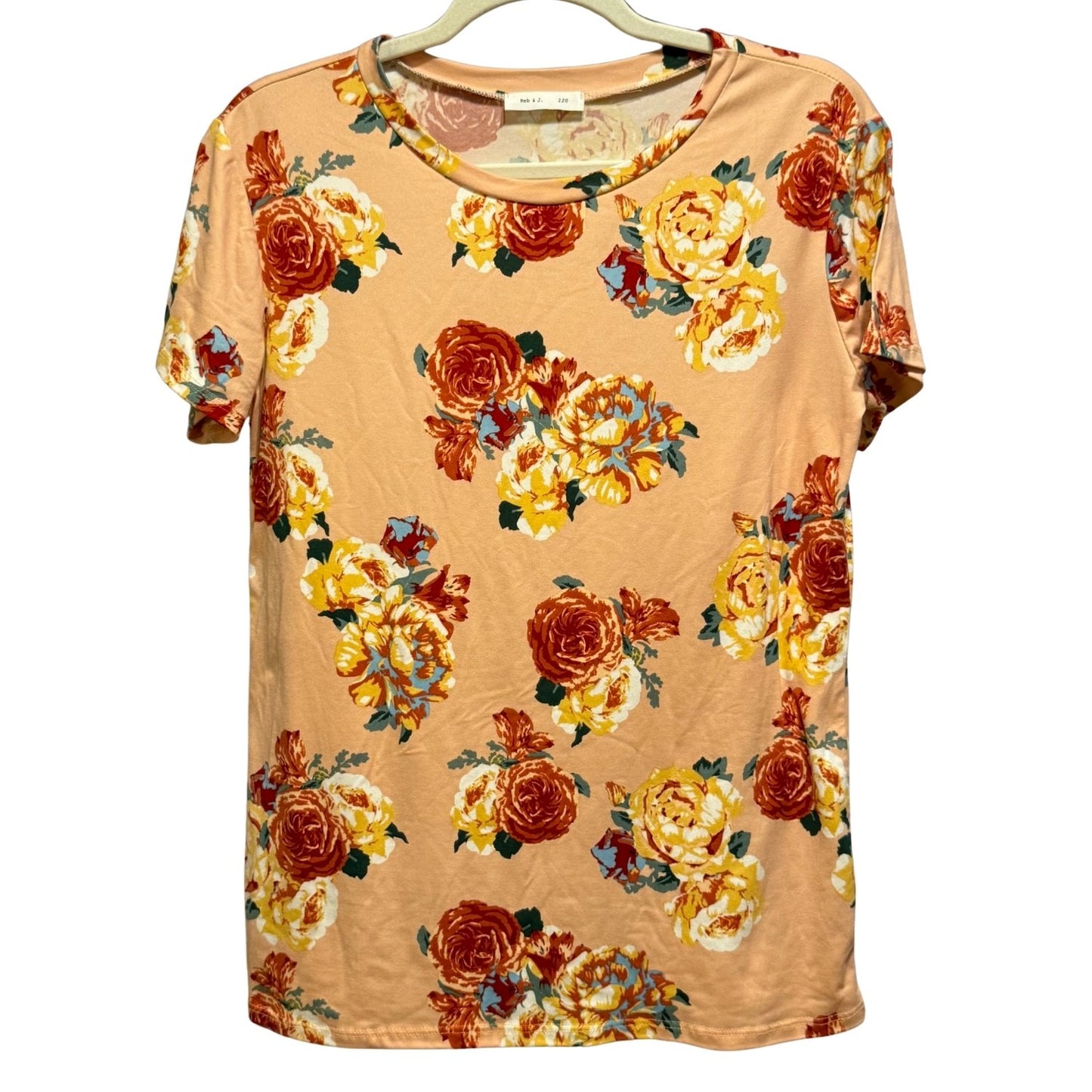 Reb & J women's peach floral short sleeve top in size Large with a round neckline and allover floral print.