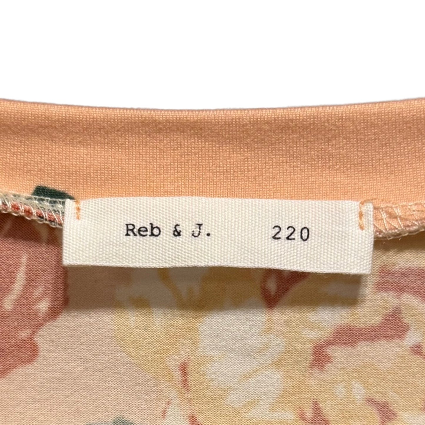 Reb & J clothing tag showing women's size Large.