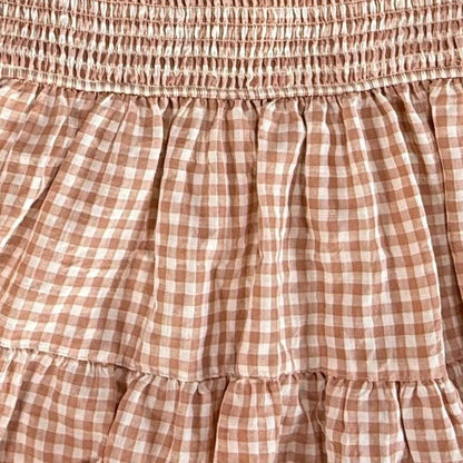 Close up of smocked bodice and gingham pattern on Rockin G blouse