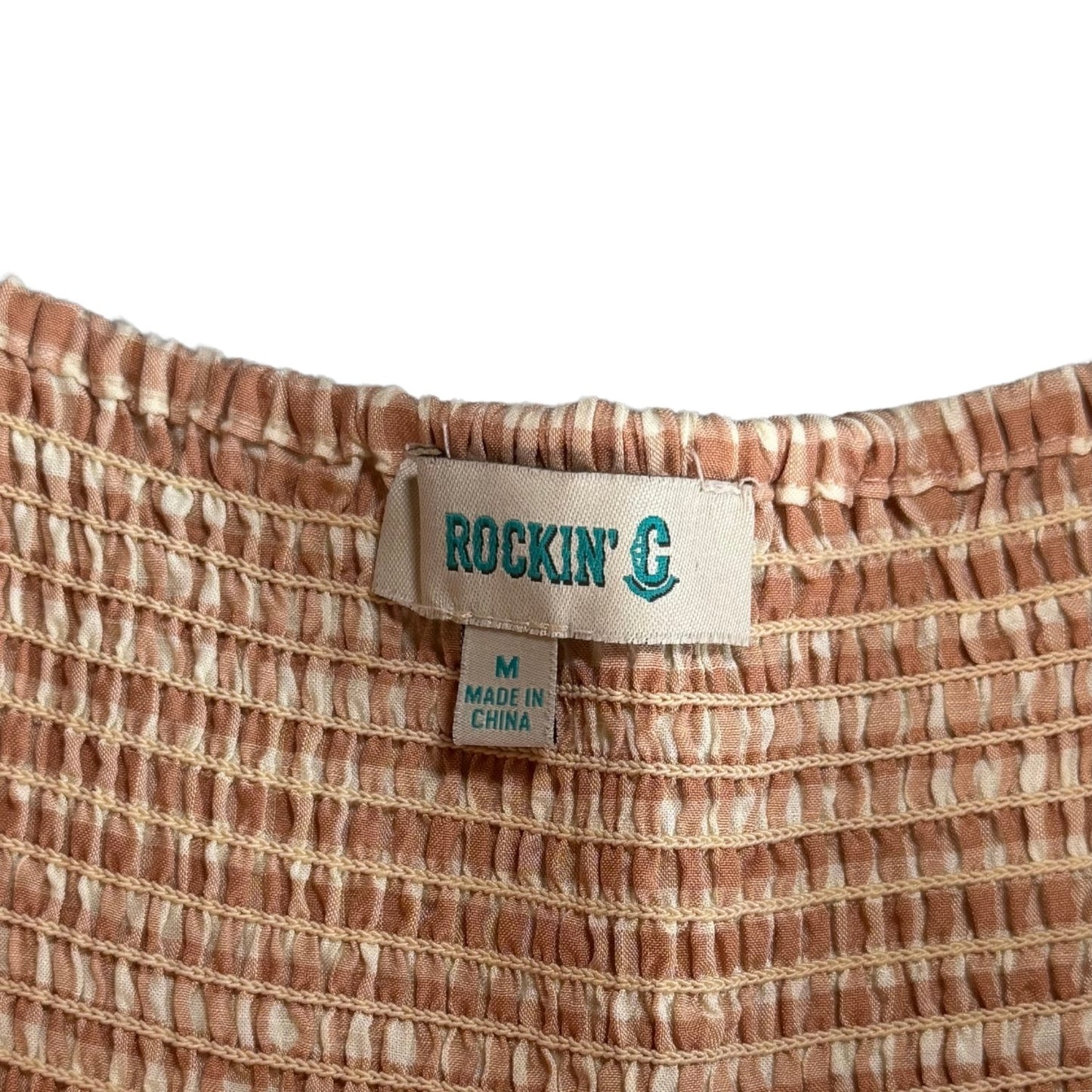 Rockin G brand tag on women's gingham smocked top