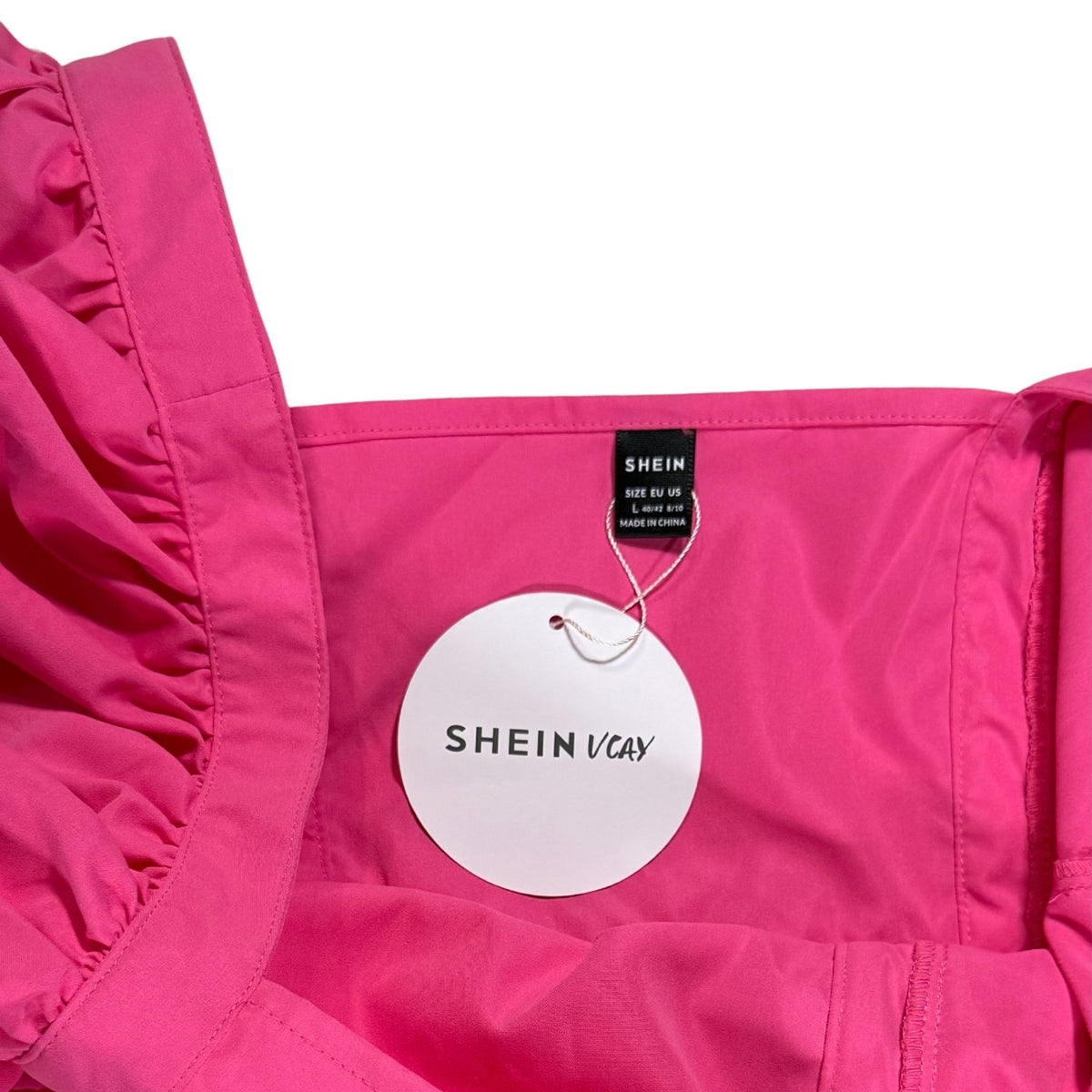 SHEIN brand tag on women's size Large bright pink mini dress.